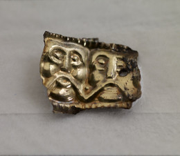 598 Sheet band in silver-gilt showing moustached heads [K1775]